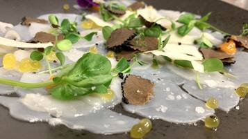 A dish with various ingredients on a plate.