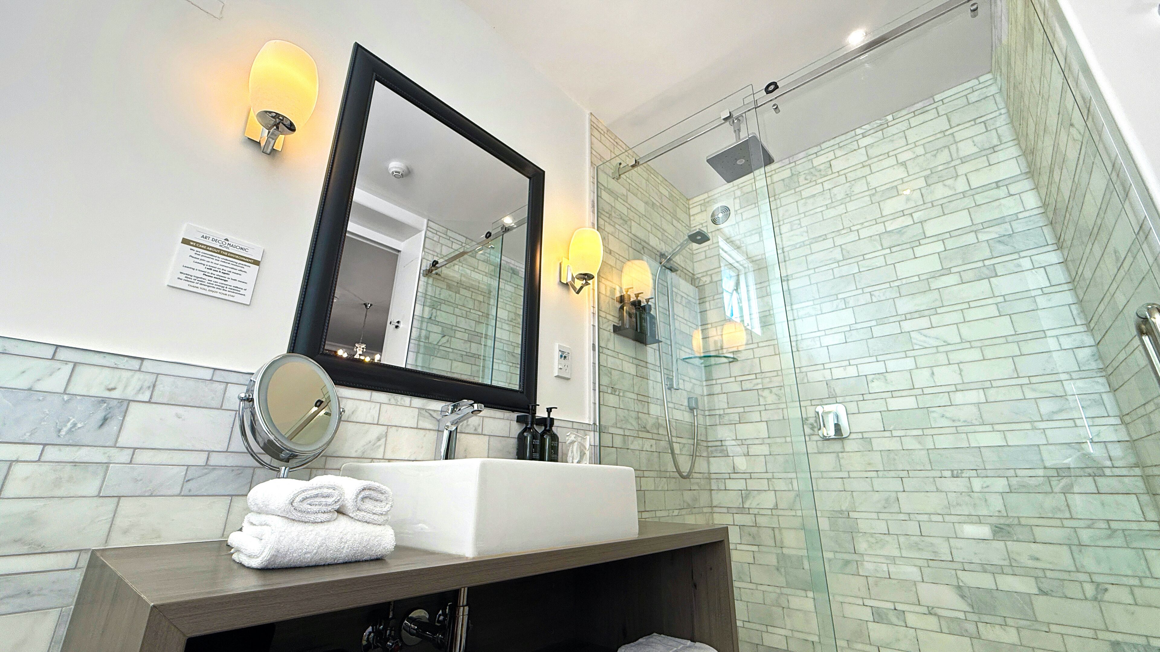 pacific view suite | bathroom | shower, free toiletries, hair dryer, towels