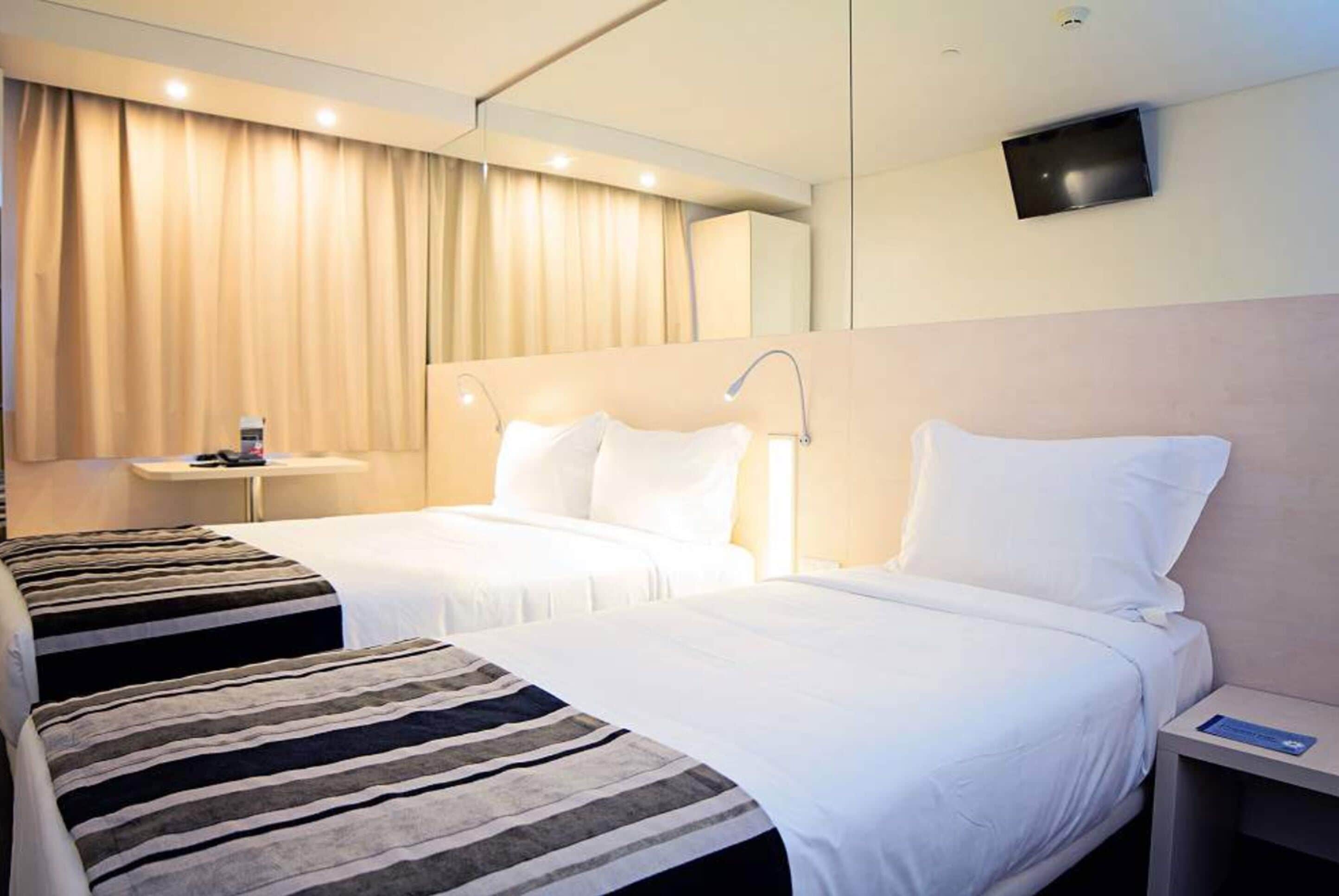 double room with extra bed | in-room safe, desk, blackout curtains, soundproofing