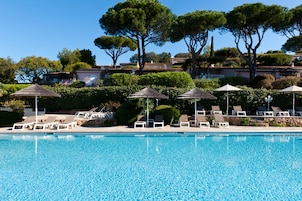 Seasonal outdoor pool, open 9:00 AM to 7:00 PM, pool umbrellas