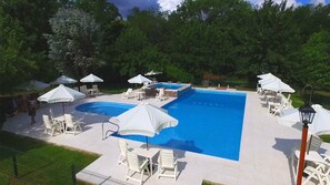 Seasonal outdoor pool, pool umbrellas, pool loungers