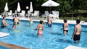 Seasonal outdoor pool, pool umbrellas, pool loungers