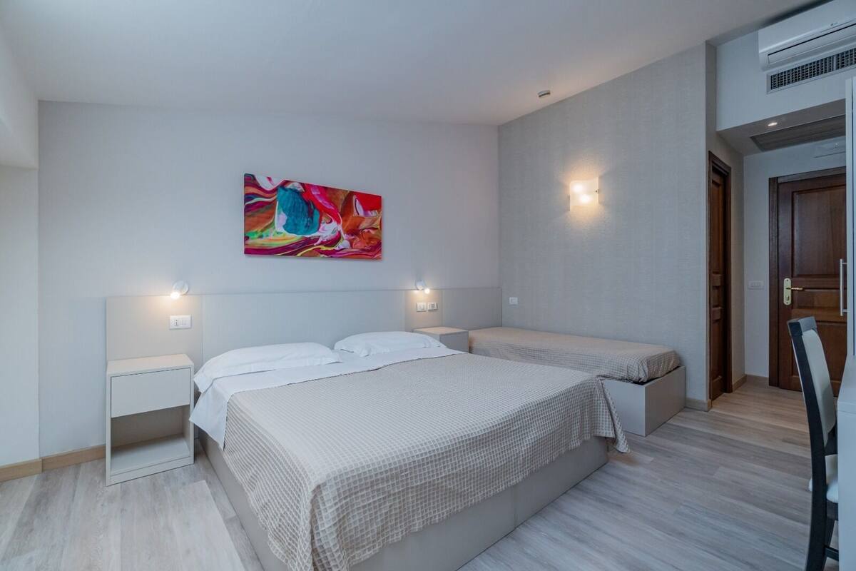 deluxe triple room | in-room safe, desk, free wifi, bed sheets