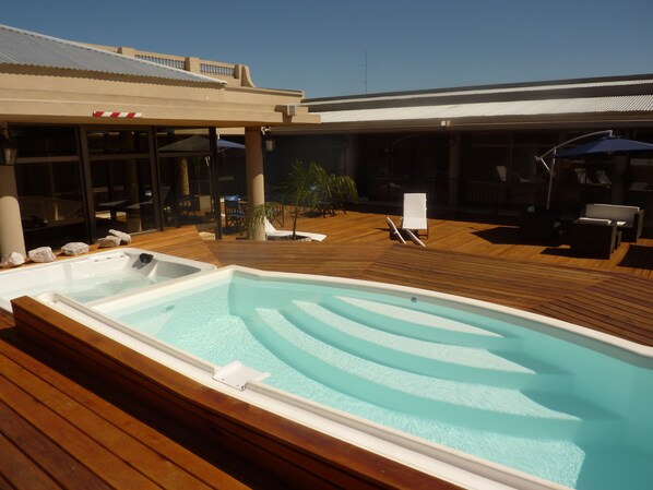 Outdoor pool, pool umbrellas, sun loungers