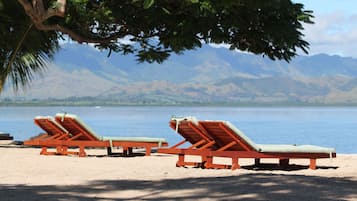 Private beach, white sand, sun loungers, beach umbrellas