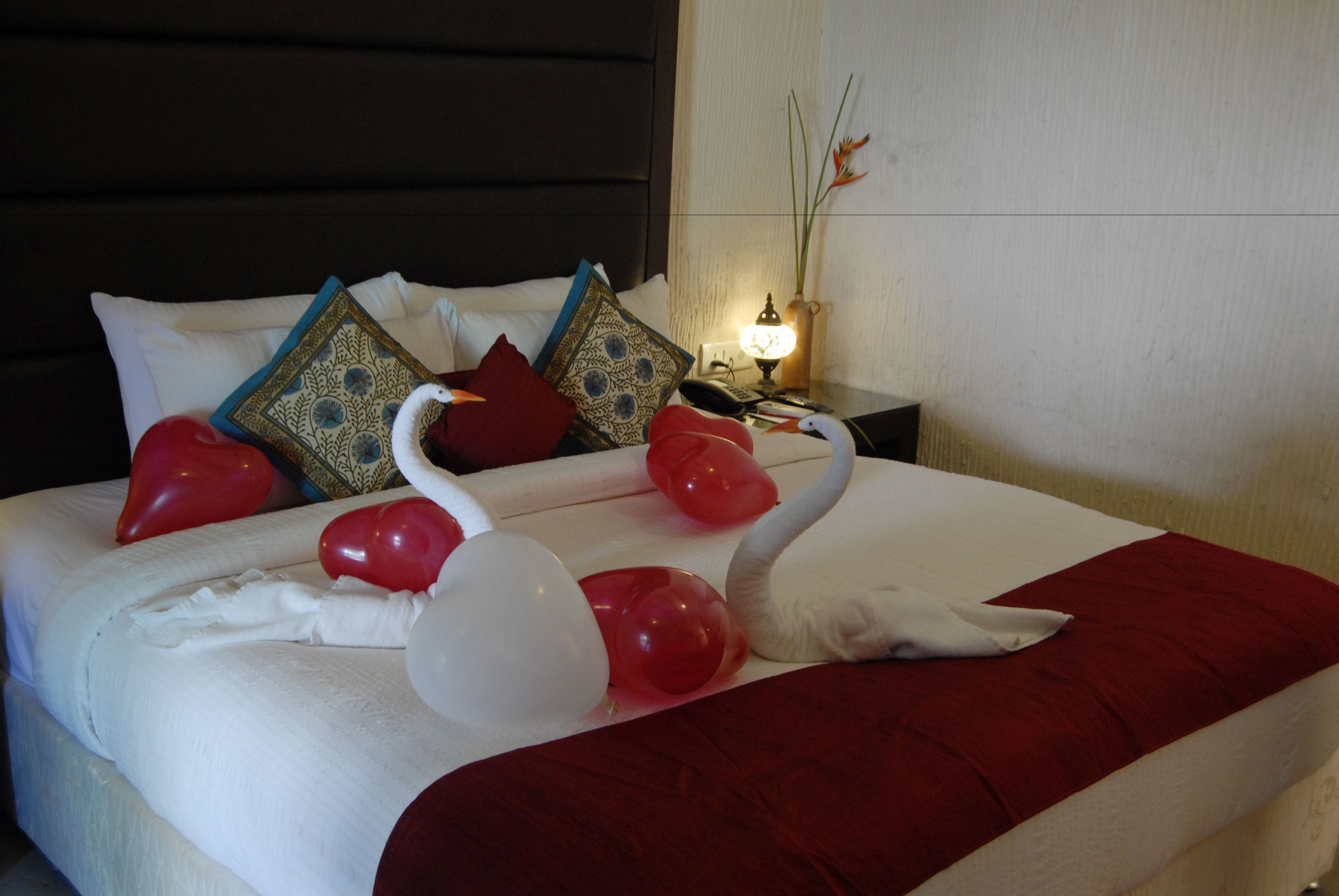 deluxe room, pool view | pillow-top beds, minibar, in-room safe, iron/ironing board