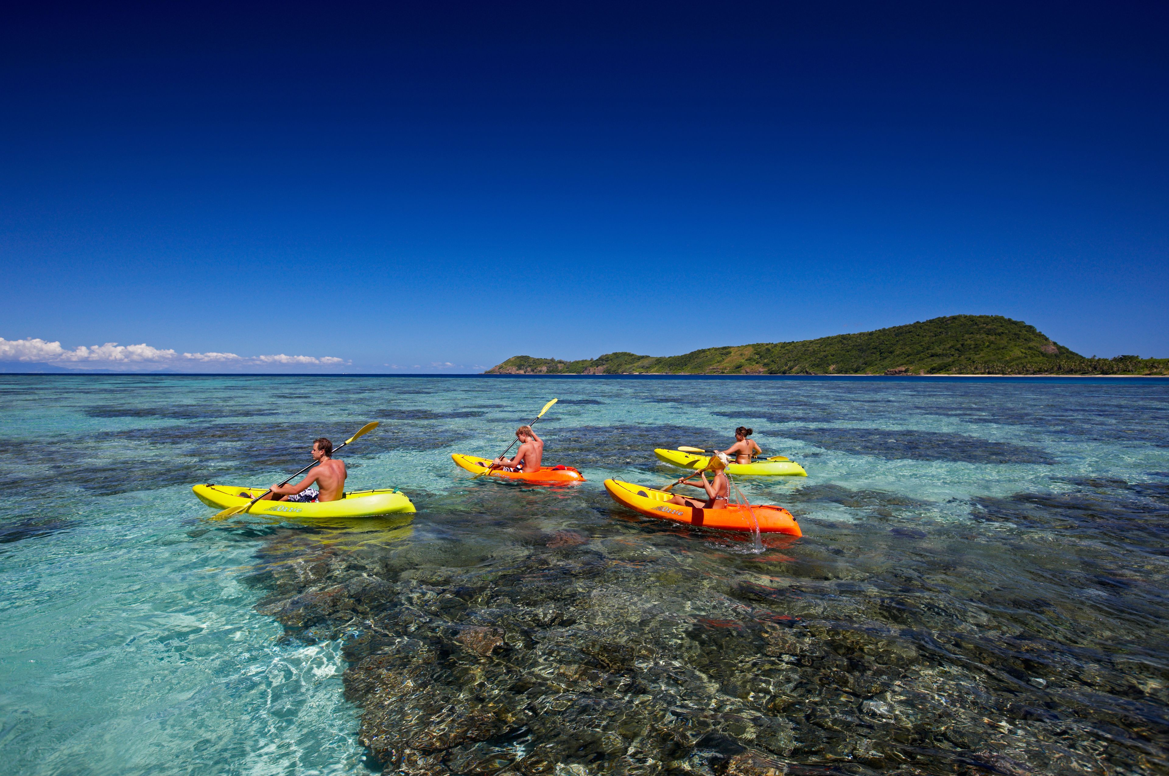On the beach, white sand, sun-loungers, beach towels