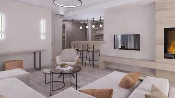 A modern living room with a fireplace, a bar area, and a seating area with sofas and a coffee table.