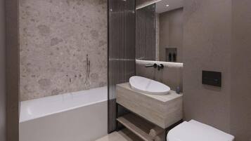 A modern bathroom with a freestanding bathtub, a marble vanity, and a large mirror.