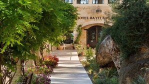 A pathway leading to a building labeled "HOTEL BAYIT BAG."