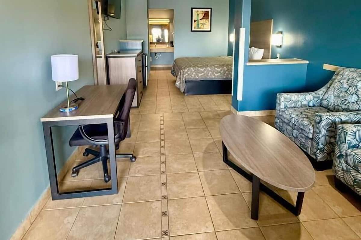 Room, 1 King Bed, Non Smoking, Jetted Tub | In-room safe, desk, iron/ironing board, free rollaway beds