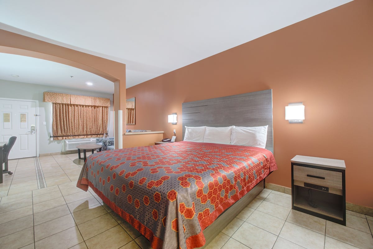 Room, 1 King Bed, Non Smoking | In-room safe, desk, iron/ironing board, free rollaway beds