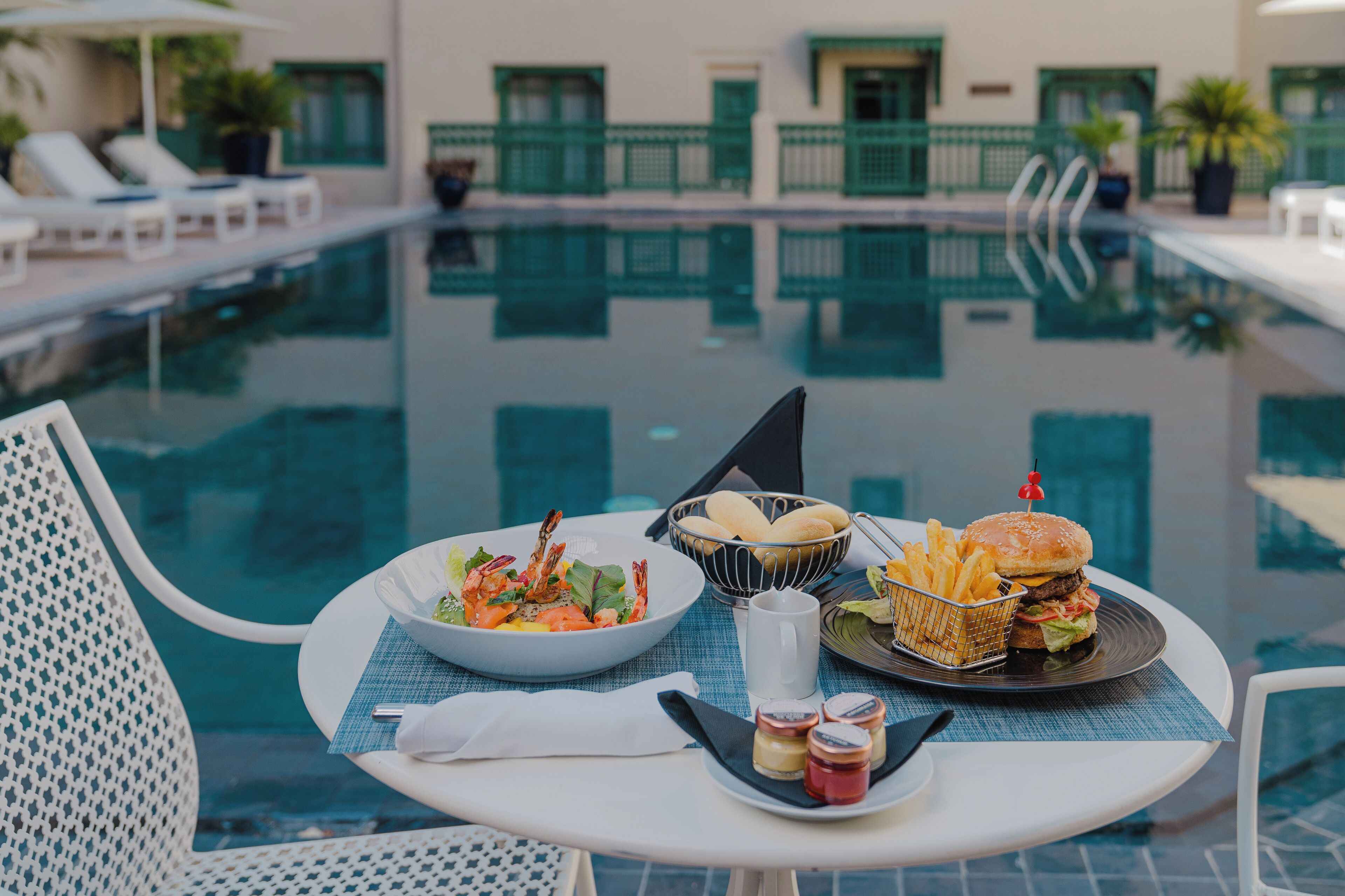 Outdoor pool, open 9:30 AM to 6:00 PM, pool umbrellas, pool loungers