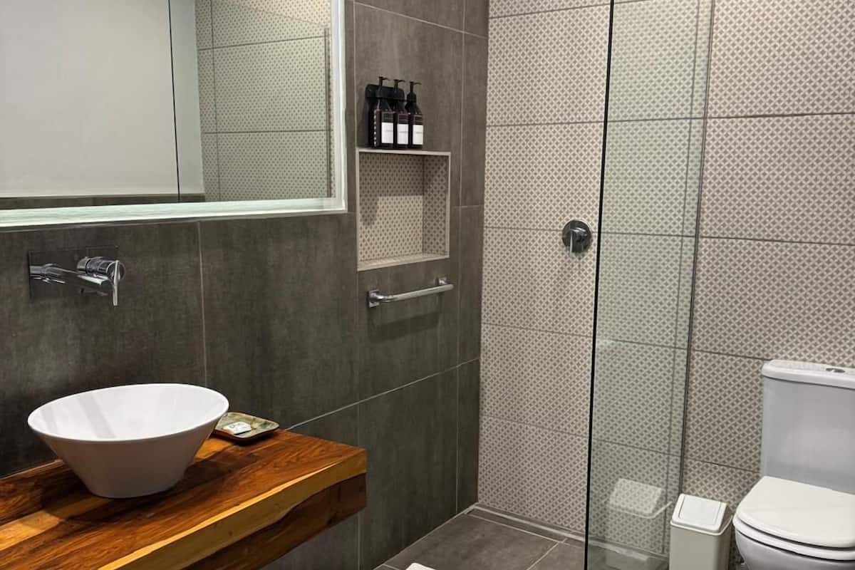 superior double room | bathroom | shower, rainfall showerhead, free toiletries, hair dryer