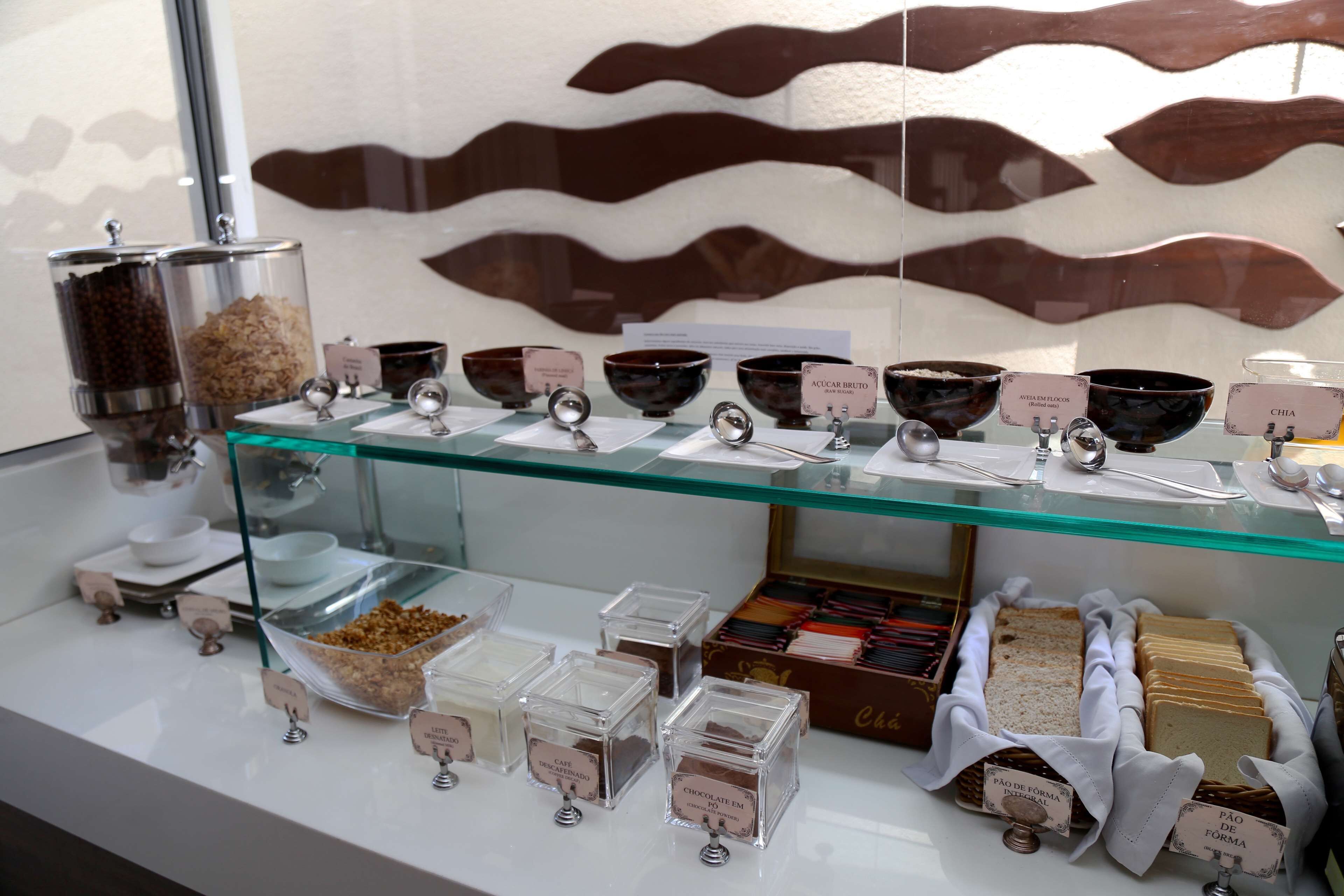 A display of various food items and containers, including bowls and boxes, with labels indicating different types of food.