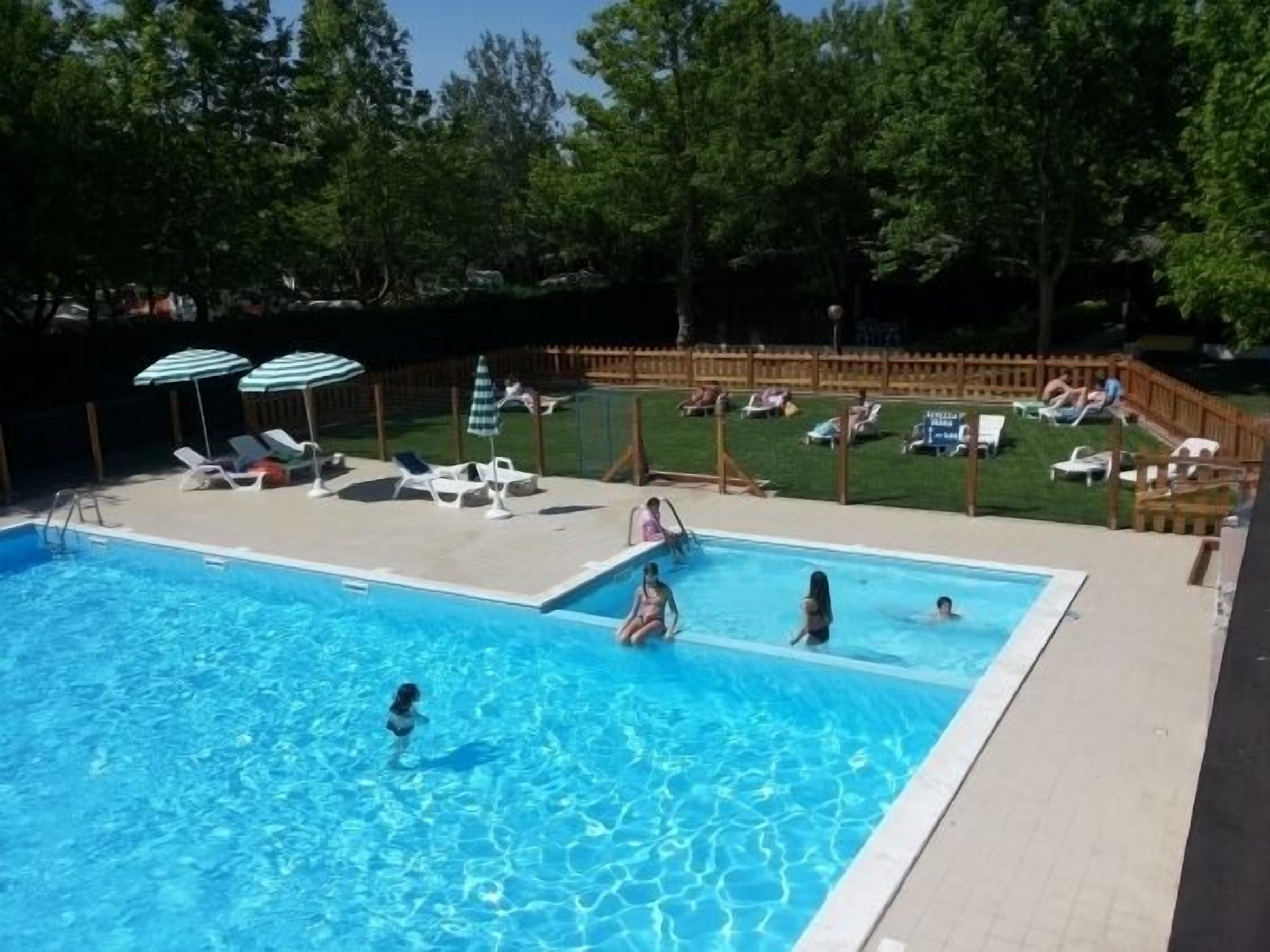 Seasonal outdoor pool, pool umbrellas, pool loungers