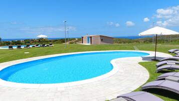 2 outdoor pools, pool umbrellas, pool loungers