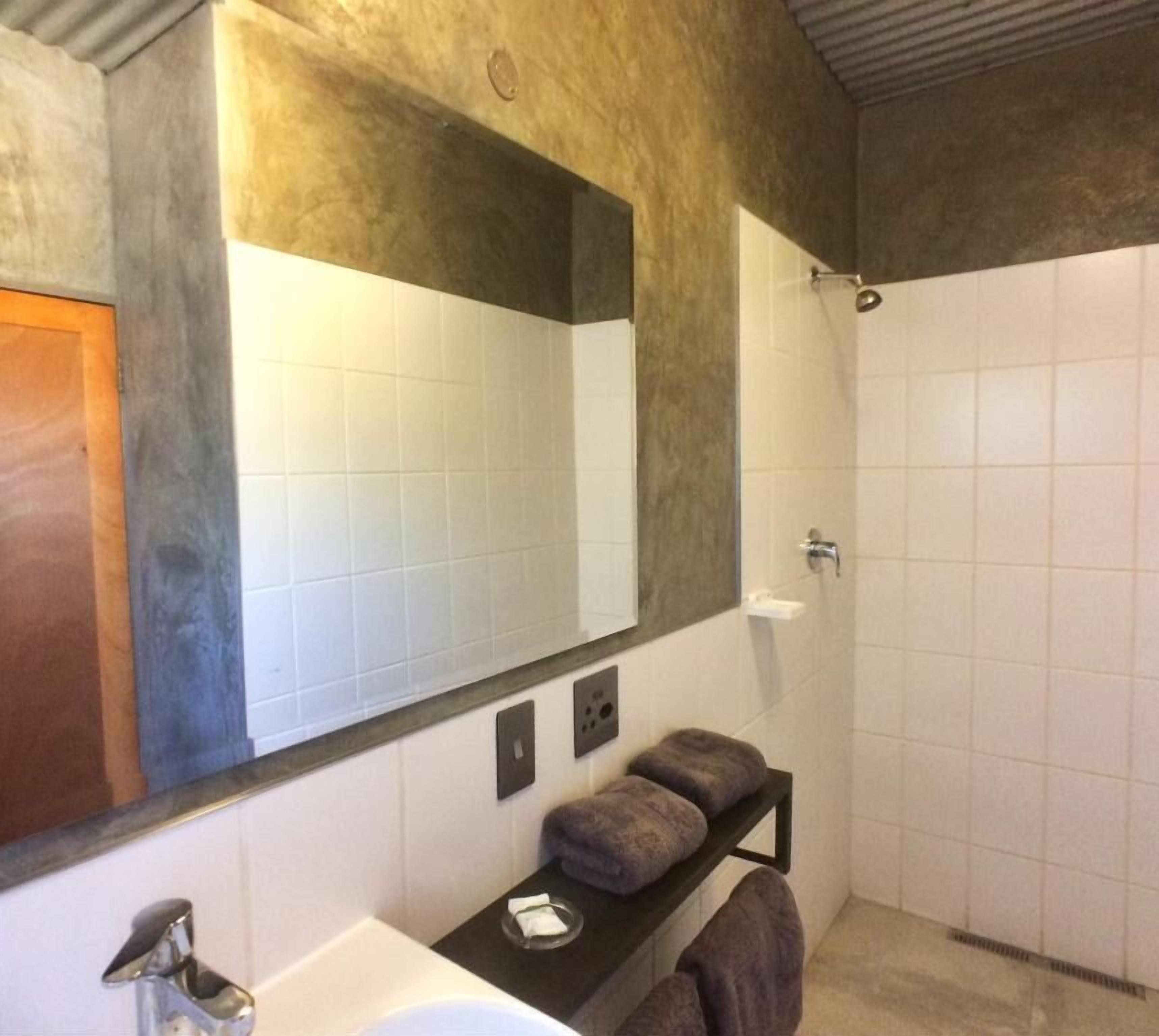 Shower, towels, soap, toilet paper
