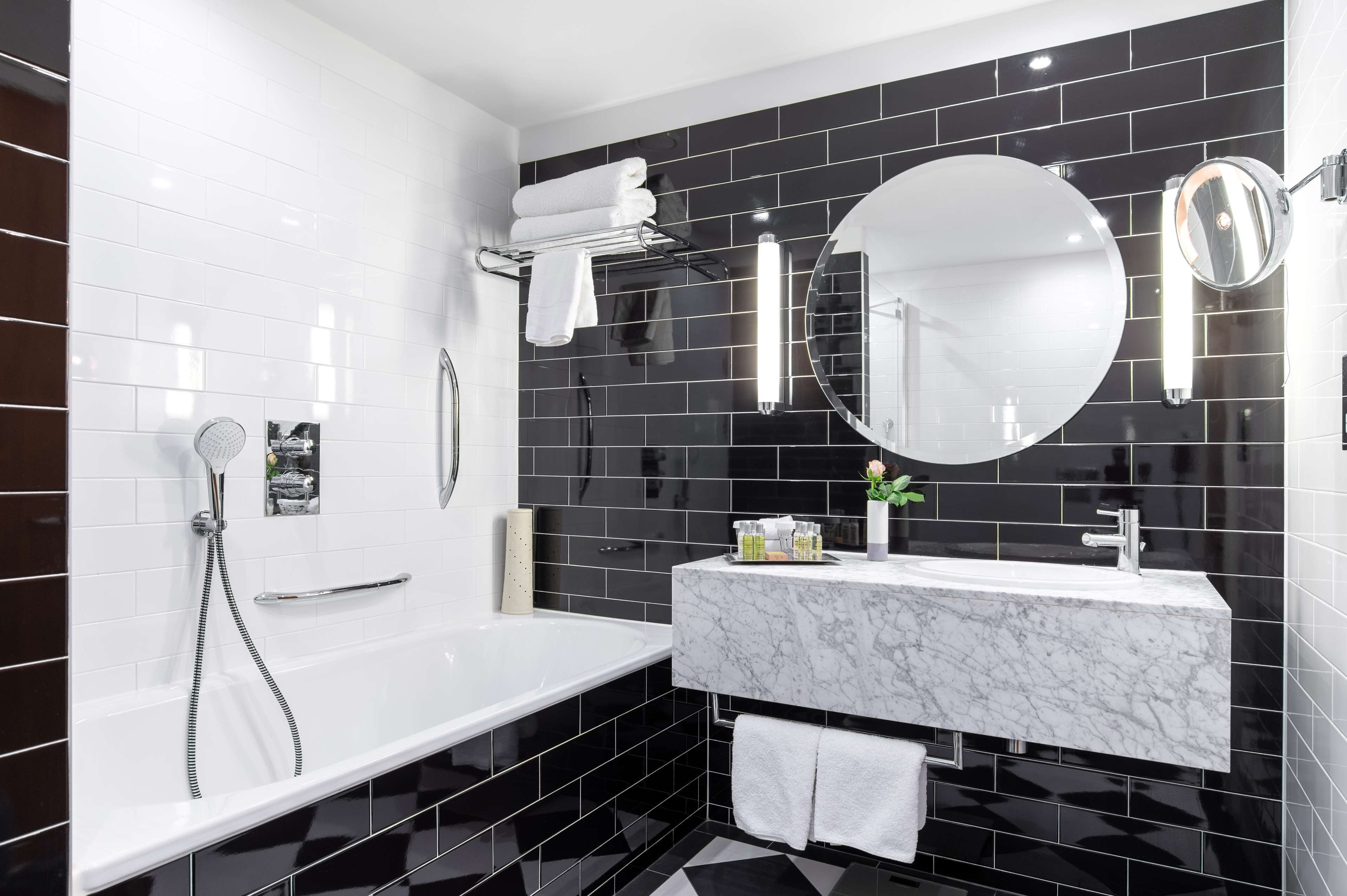 designer toiletries, hair dryer, towels