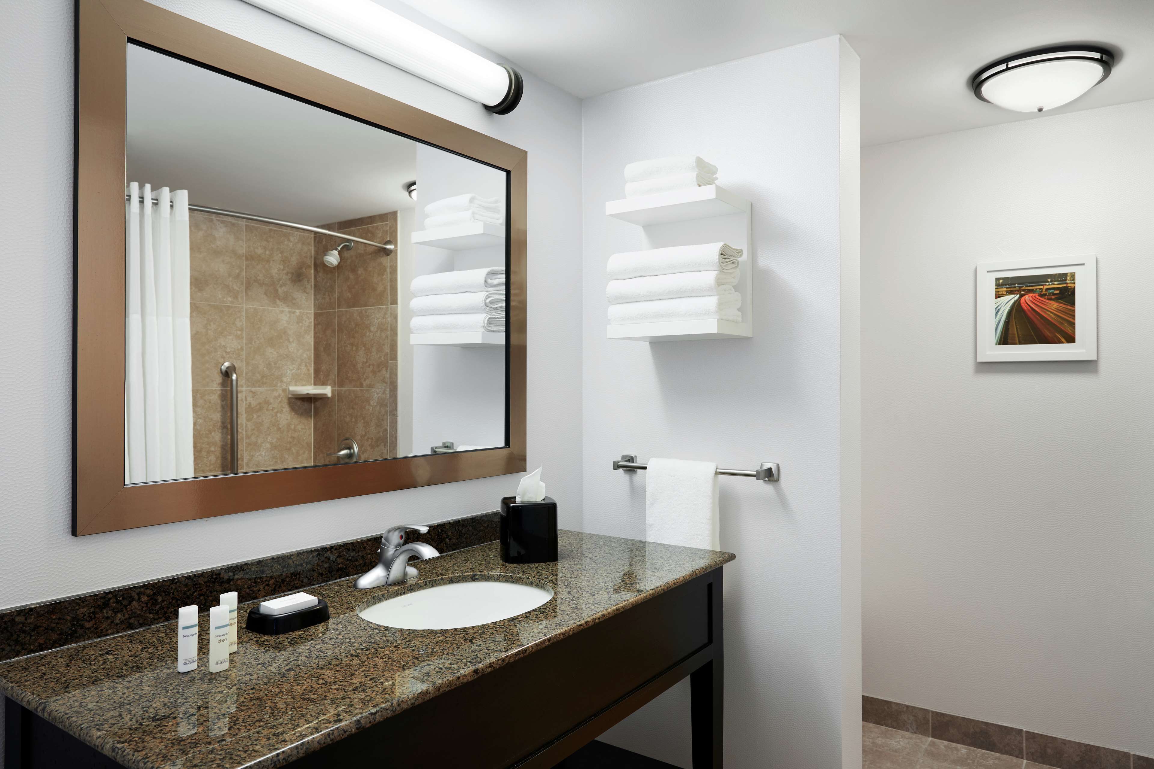 combined shower/bathtub, deep-soaking bathtub, hair dryer, towels