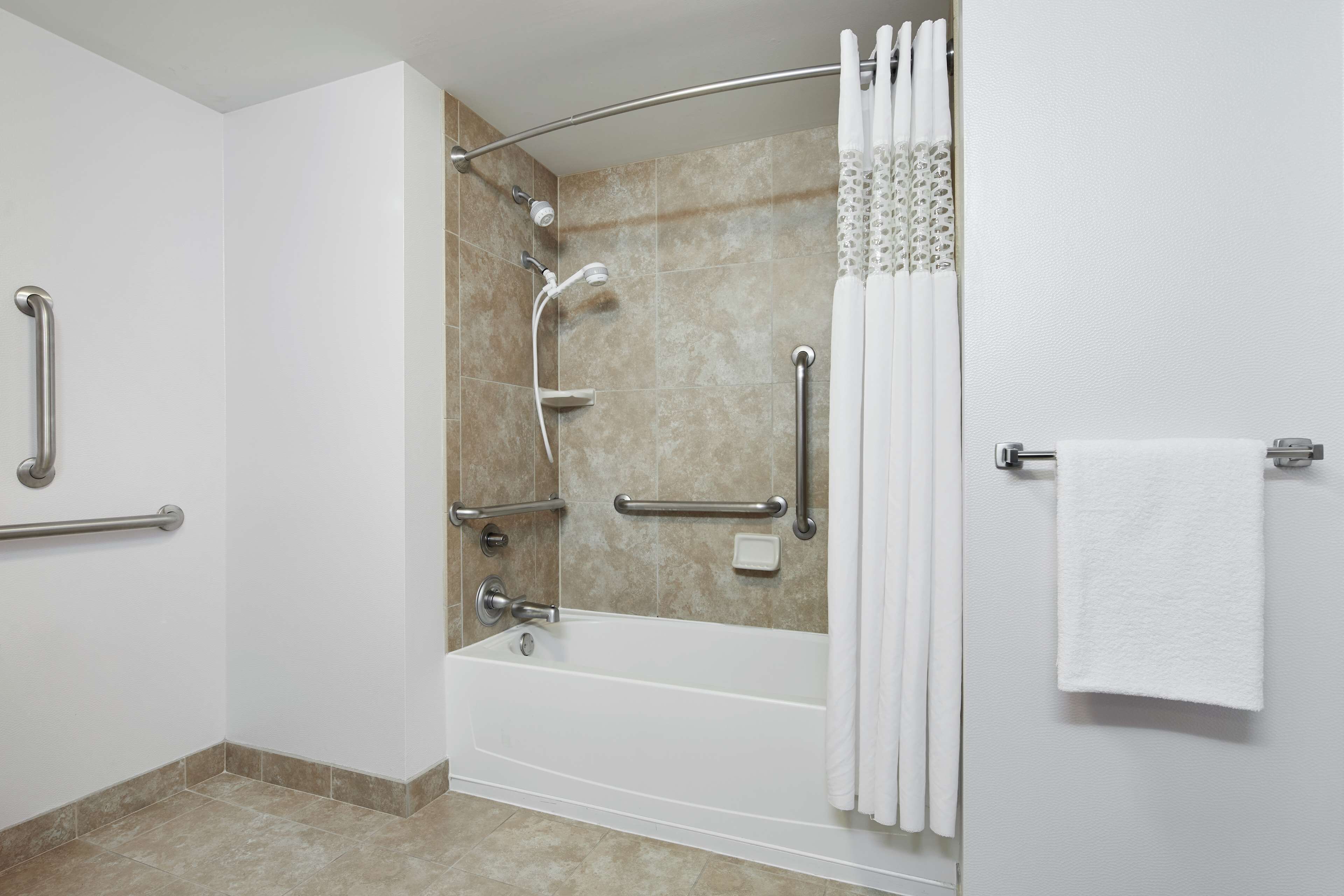 combined shower/bathtub, deep-soaking bathtub, hair dryer, towels