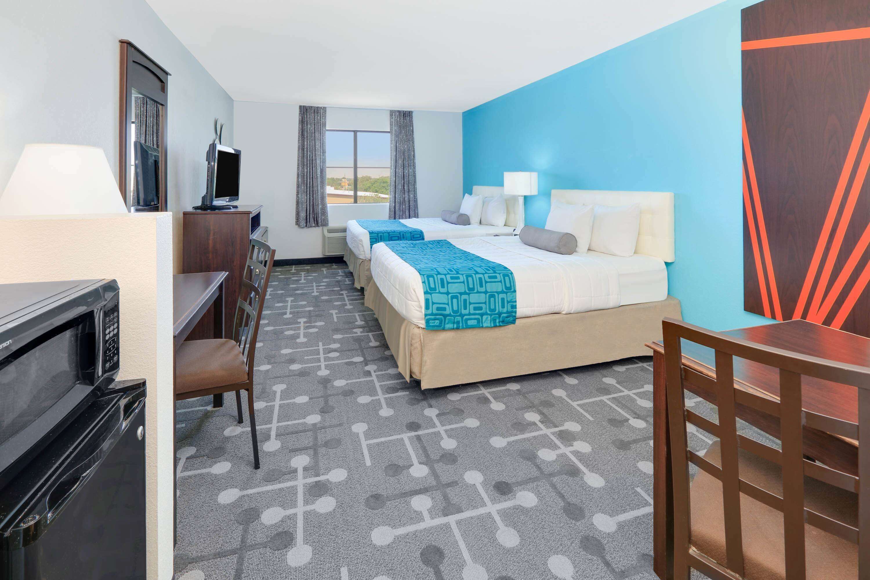 Standard Room, 2 Queen Beds, Non Smoking | In-room safe, desk, iron/ironing board, free cribs/infant beds