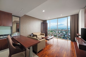Suite, 1 Queen Bed | Living area | LCD TV