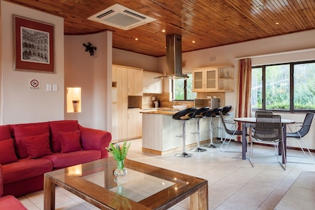 Villa | Living area | Flat-screen TV, fireplace