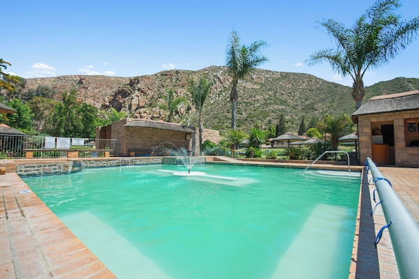 4 outdoor pools, open 8:00 AM to 10:00 PM, pool umbrellas, sun loungers