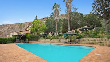 4 outdoor pools, open 8:00 AM to 10:00 PM, pool umbrellas, sun loungers