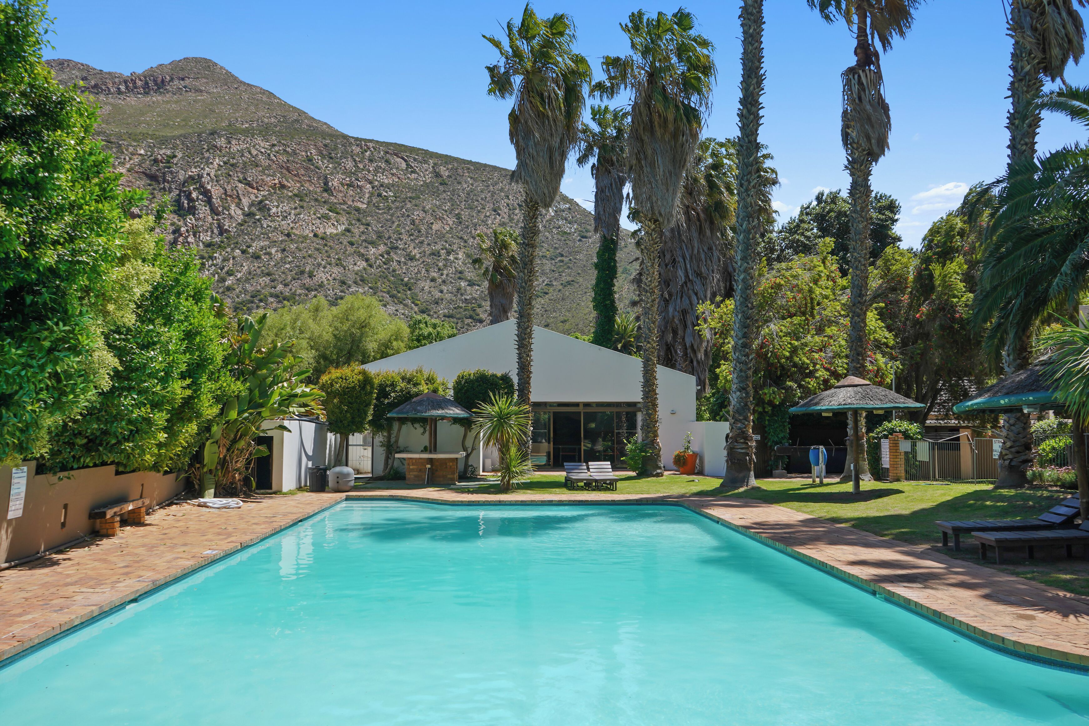 4 outdoor pools, open 8:00 AM to 10:00 PM, pool umbrellas, sun loungers
