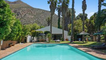 4 outdoor pools, open 8:00 AM to 10:00 PM, pool umbrellas, sun loungers