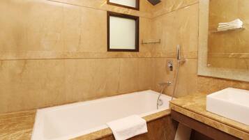 Deluxe Room | Bathroom | Spring water bathtub, rainfall showerhead, free toiletries, hair dryer
