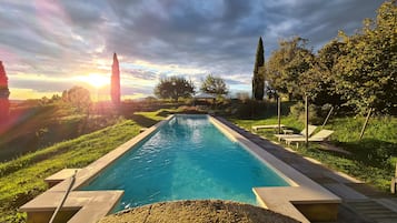 Seasonal outdoor pool, pool loungers
