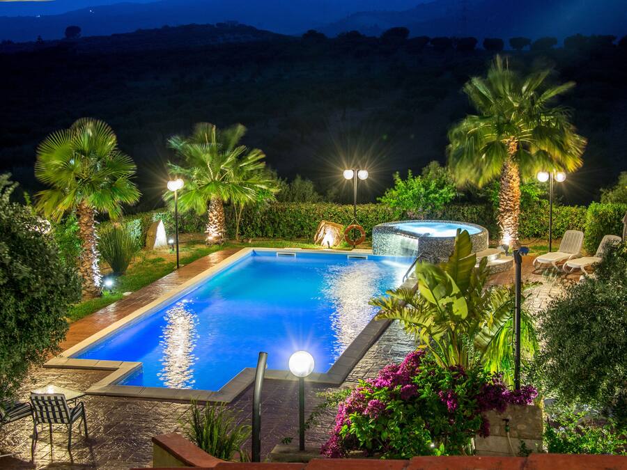 Seasonal outdoor pool, open 9 AM to 7:30 PM, pool umbrellas