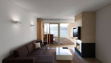 Apartment, 1 Bedroom, Sea View | Living area | 42-cm LCD TV with digital channels, TV, fireplace