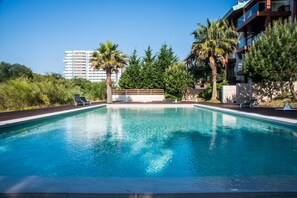 Outdoor pool, pool umbrellas, pool loungers