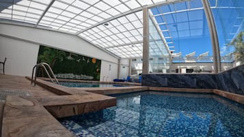 Indoor pool, open 7:00 AM to 10:00 PM, sun loungers