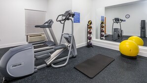 A gym with treadmills, a stationary bike, and exercise balls. - Days Inn by Wyndham Valdosta/Near Valdosta Mall (Valdosta)