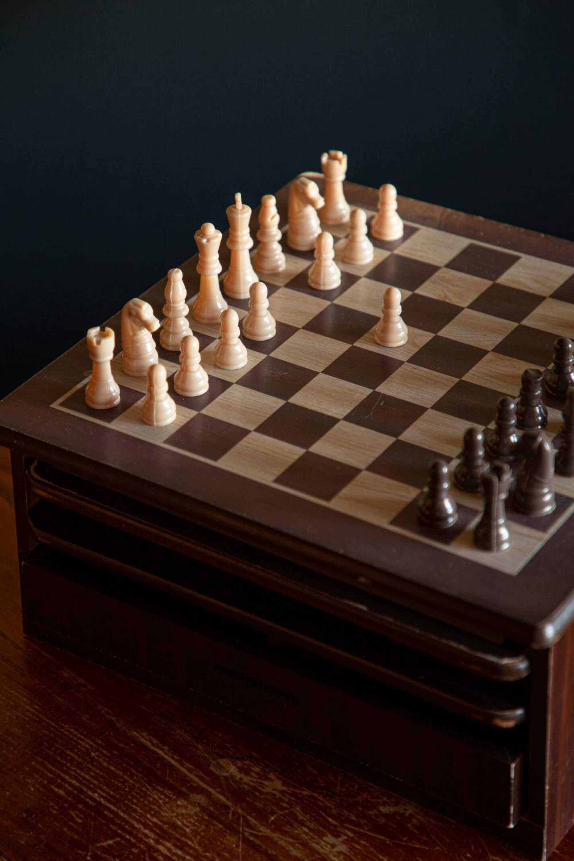 A chessboard with pieces set up for a game.
