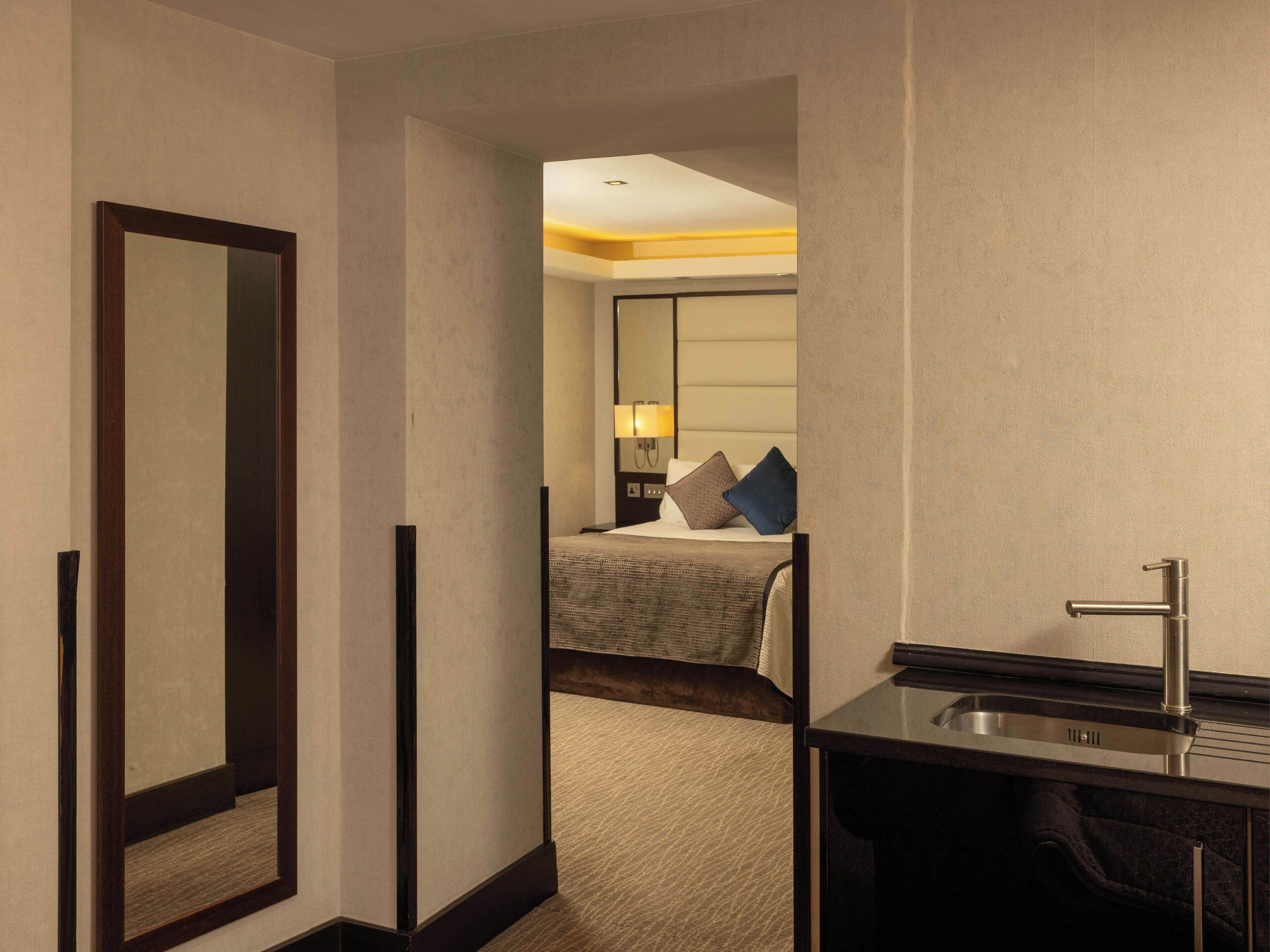 family room | premium bedding, minibar, in-room safe, desk