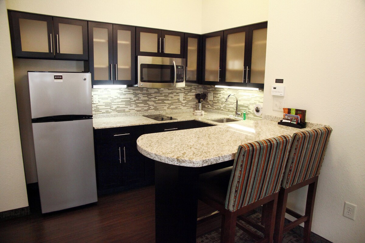 Desk, iron/ironing board, cribs (free), WiFi (free)