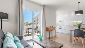 Junior Suite | 2 bedrooms, in-room safe, laptop workspace, iron/ironing board