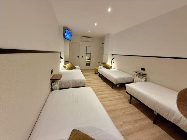 Family Quadruple Room, Multiple Beds, Balcony, City View | Desk, soundproofing, free WiFi, bed sheets