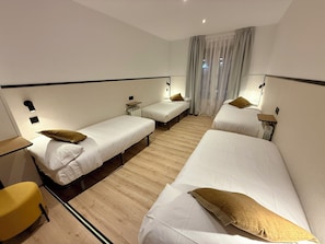 Family Quadruple Room, Multiple Beds, Balcony, City View | Desk, soundproofing, free WiFi, bed sheets