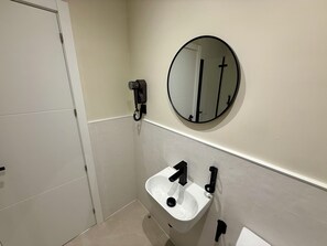 Family Quadruple Room, Multiple Beds, Balcony, City View | Bathroom | Shower, hair dryer, towels