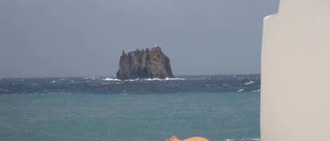 On the beach, black sand