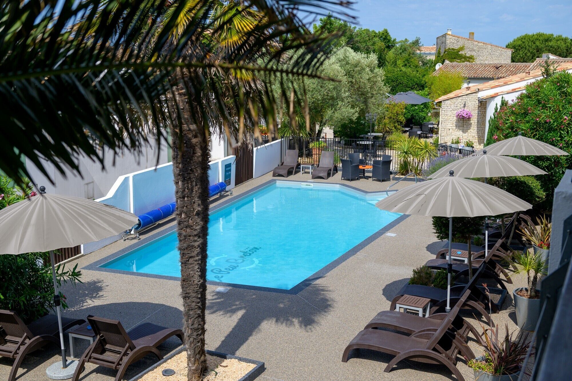 seasonal outdoor pool, open 10 am to 8 pm, pool umbrellas, pool loungers