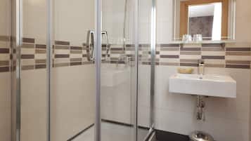 Shower, free toiletries, hair dryer, towels