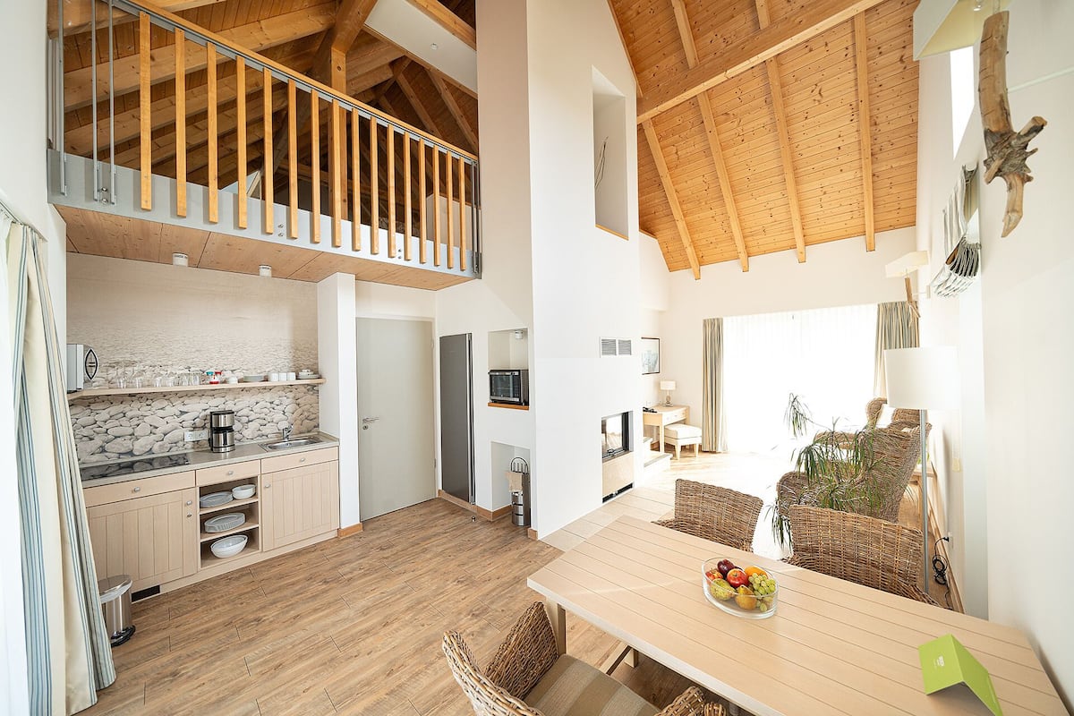 standard villa, 1 bedroom, lake view | living area | flat-screen tv